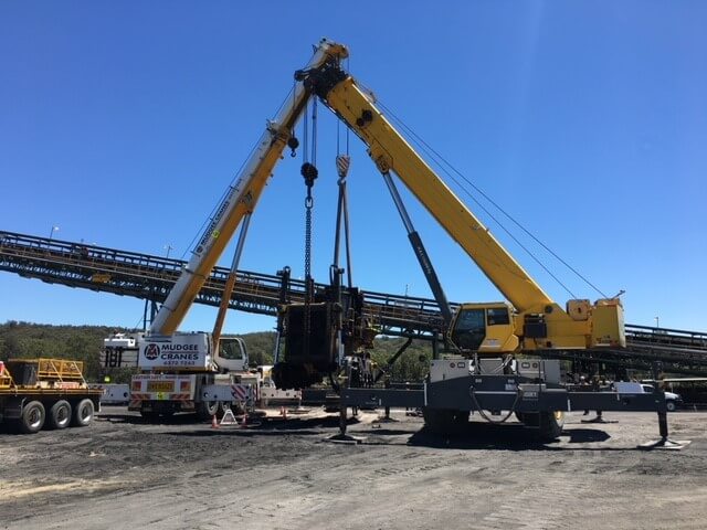 Dual crane lift including lift consultation and riggers for 475 dozer body at Moolarben Coal