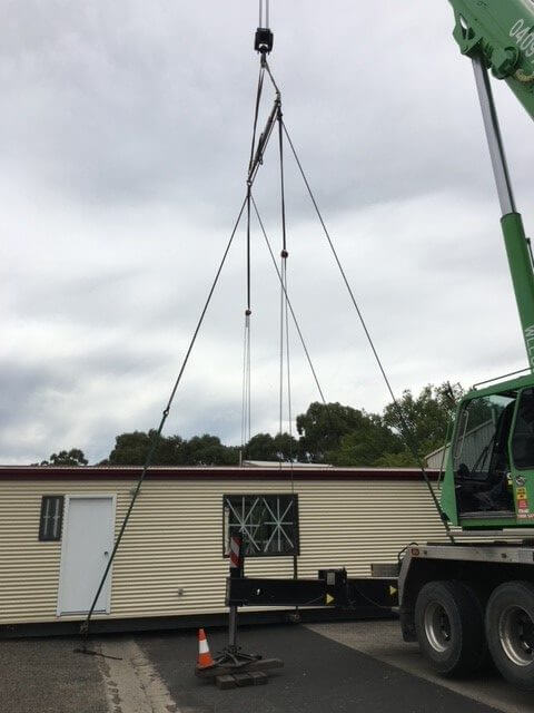 Supply of cranage and rigging for placement of newly constructed portable home